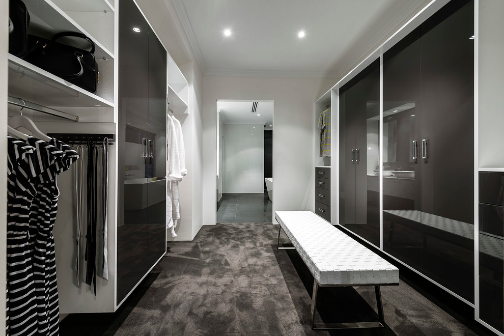 This is an example of a contemporary gender-neutral dressing room in Perth with flat-panel cabinets, grey cabinets and carpet.