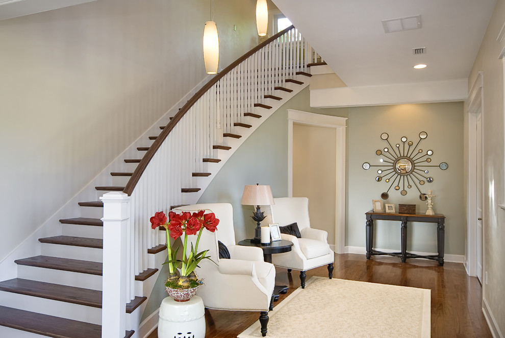 Design ideas for a transitional wood curved staircase in Other.