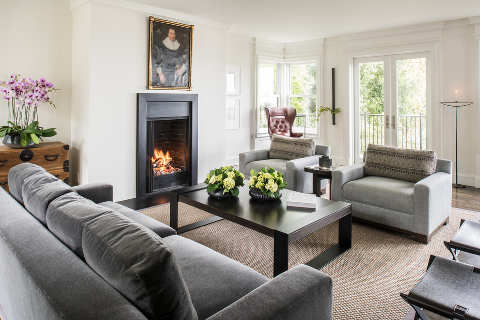 Inspiration for a transitional open concept living room in San Francisco with white walls, dark hardwood floors, a standard fireplace, a metal fireplace surround and no tv.