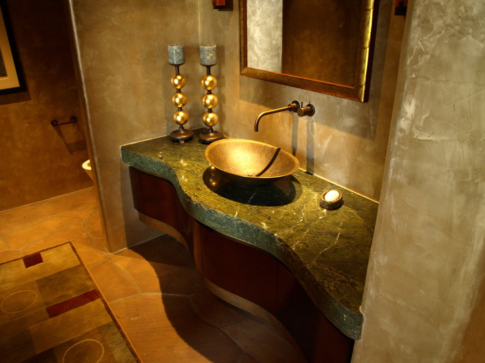 Contemporary powder room in Phoenix with green benchtops.