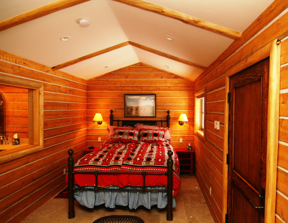 This is an example of a mid-sized country master bedroom in Boise.