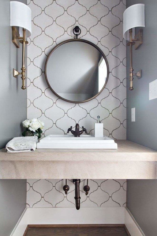 Inspiration for a small transitional powder room in Birmingham with white tile, cement tile, a drop-in sink, limestone benchtops, brown floor and beige benchtops.