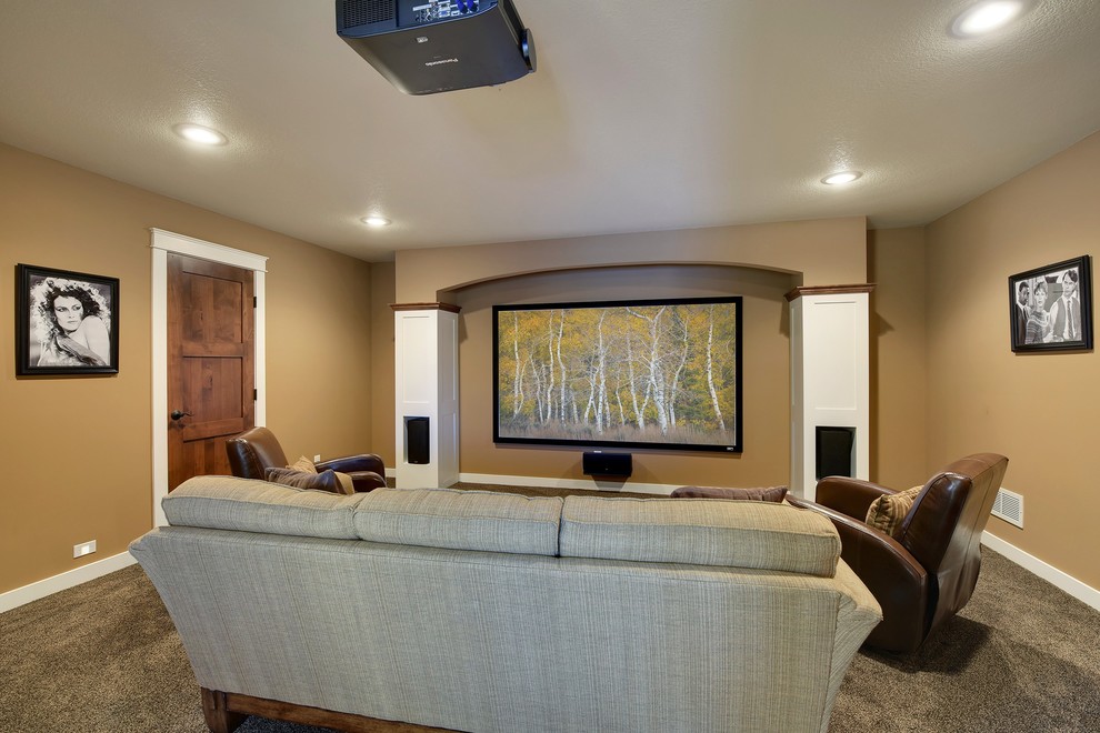 Inspiration for a large arts and crafts enclosed home theatre in Minneapolis with brown walls, carpet and a projector screen.