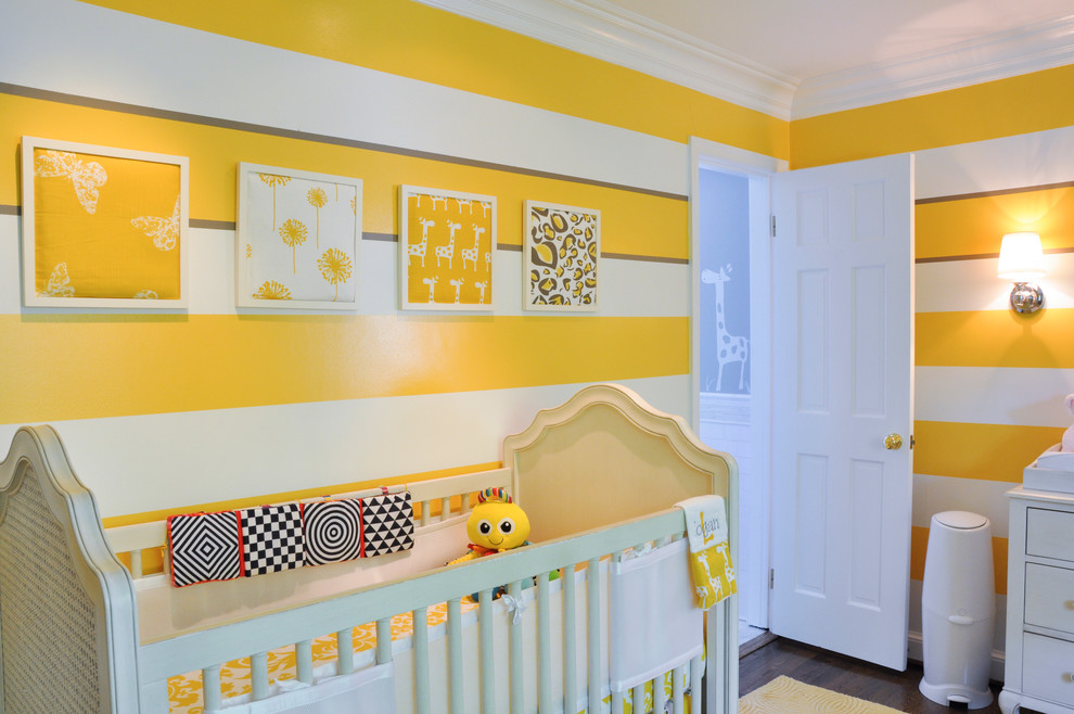Inspiration for a transitional gender-neutral nursery in DC Metro with yellow walls and dark hardwood floors.