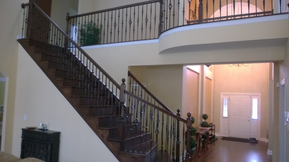 Example of a large transitional medium tone wood floor foyer design in Chicago with beige walls
