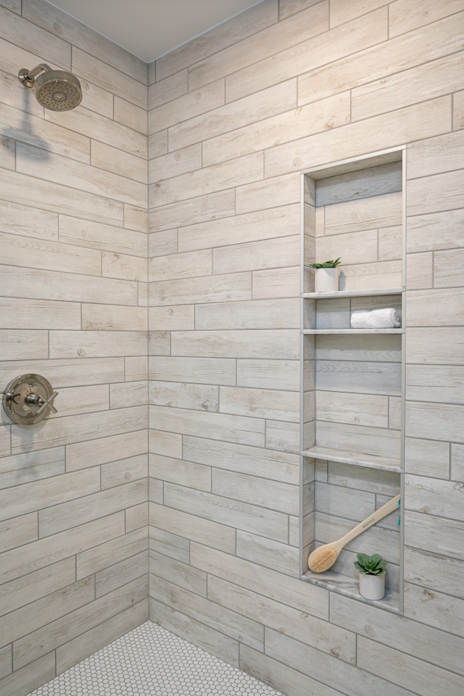 This is an example of a mid-sized country master bathroom in Raleigh with shaker cabinets, white cabinets, a double shower, a two-piece toilet, white tile, porcelain tile, white walls, porcelain floors, an undermount sink, marble benchtops, grey floor, a hinged shower door, grey benchtops, an enclosed toilet, a double vanity and planked wall panelling.
