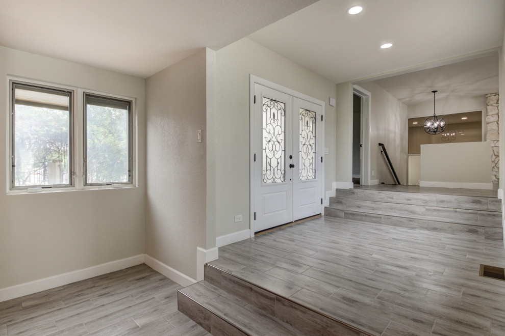 Example of a mid-sized transitional porcelain tile and gray floor entryway design in Phoenix