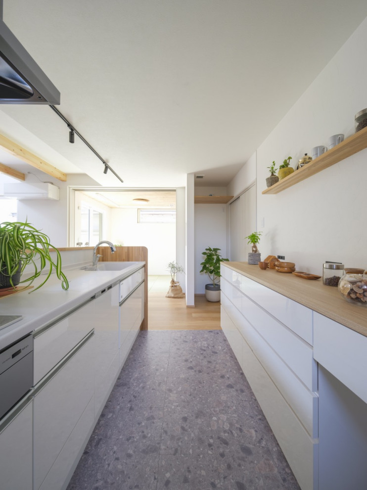 Photo of a medium sized modern galley kitchen pantry in Other with an integrated sink, beaded cabinets, white cabinets, composite countertops, white splashback, vinyl flooring, an island, grey floors, brown worktops and a wallpapered ceiling.