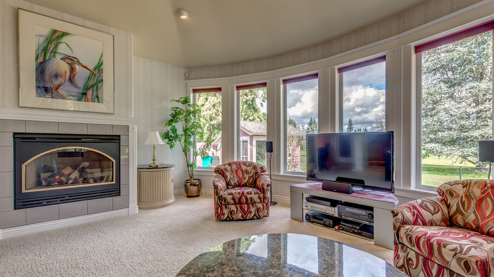 Inspiration for a large transitional open concept carpeted family room remodel in Portland with white walls, a standard fireplace, a tile fireplace and a tv stand