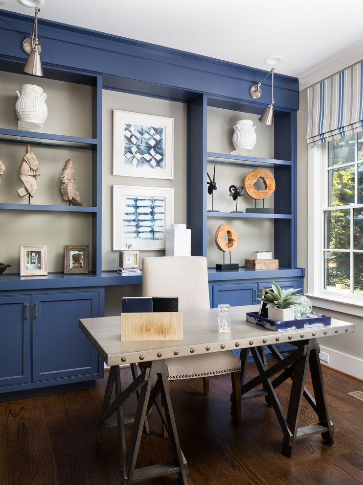 Example of a beach style freestanding desk dark wood floor and brown floor study room design in Birmingham with beige walls