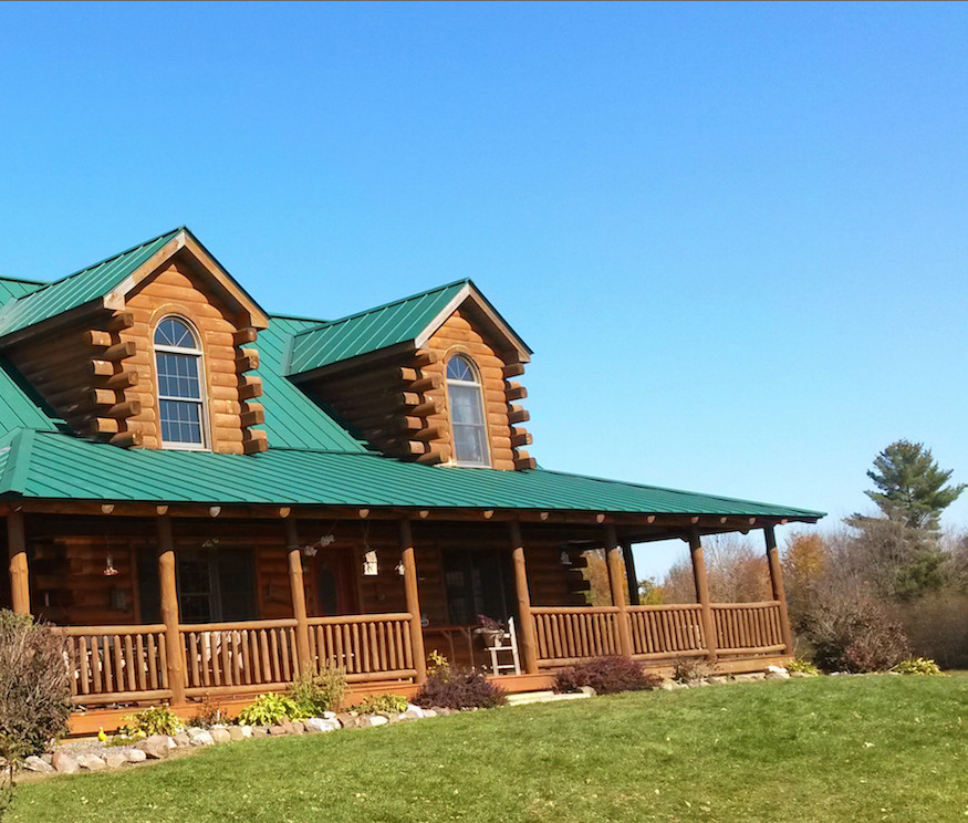 Large rustic brown two-story wood exterior home idea