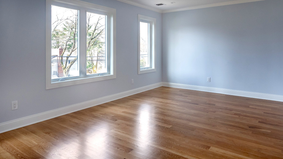 Bedroom with Balcony Access and Wood Floors