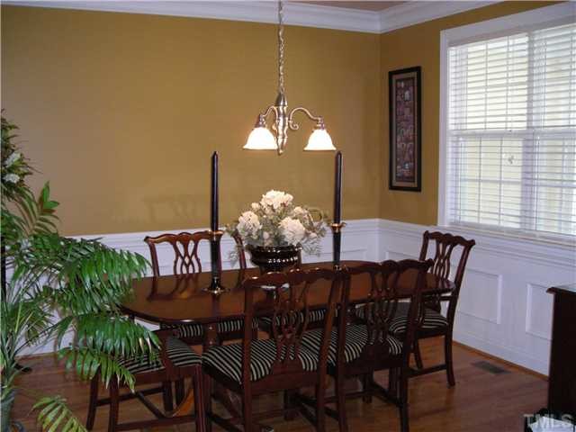 Example of a classic dining room design in Raleigh