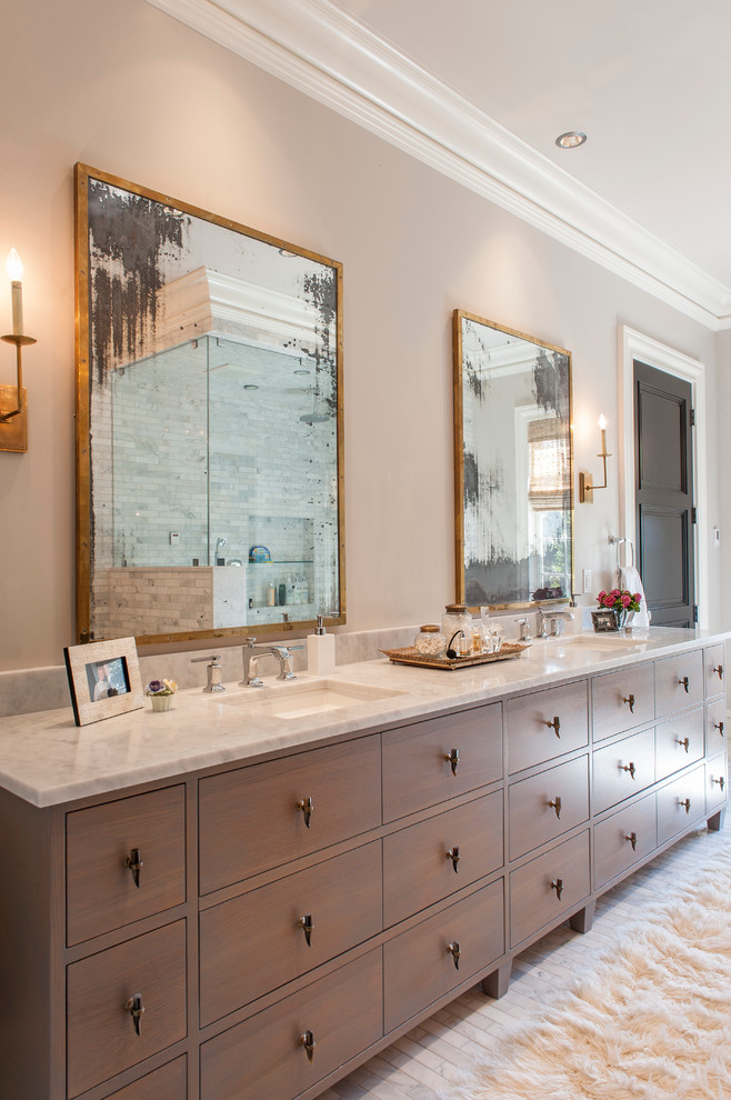 This is an example of a large transitional master bathroom in Indianapolis with an undermount sink, medium wood cabinets, marble benchtops, a two-piece toilet, white tile, stone tile, beige walls, marble floors and flat-panel cabinets.