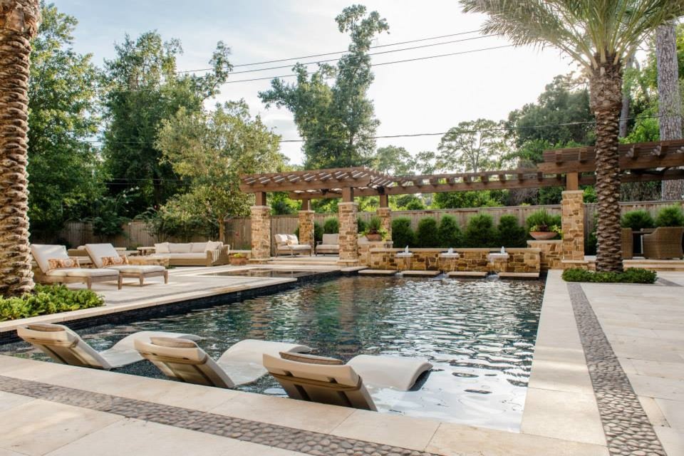 Large mediterranean backyard rectangular lap pool in Houston with a hot tub and tile.