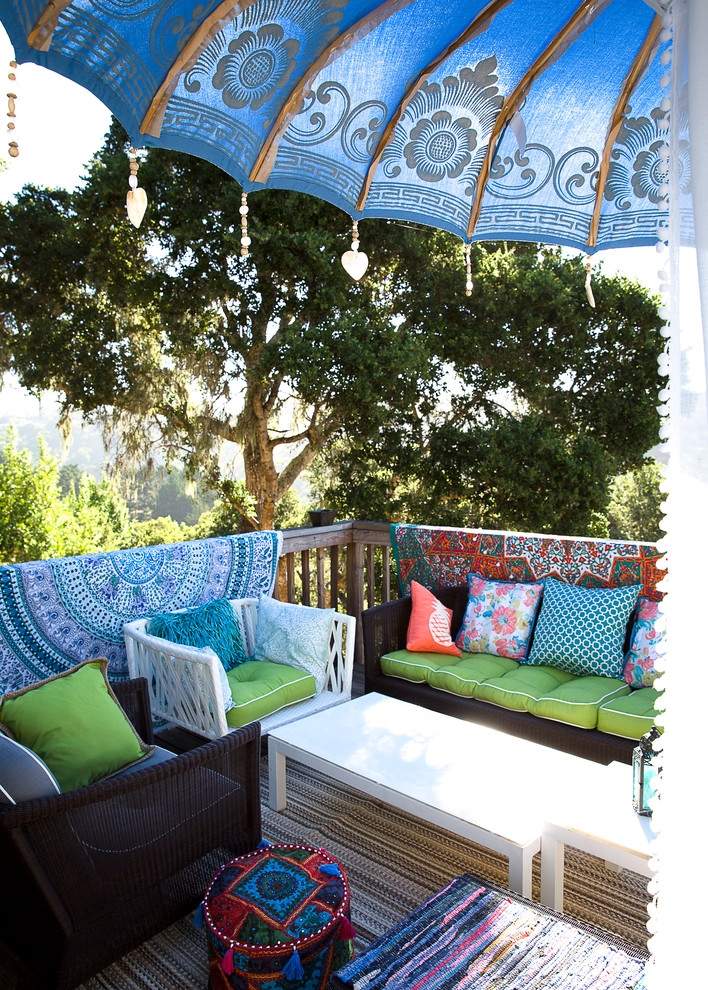 Mid-sized eclectic backyard patio photo in San Francisco with decking and no cover