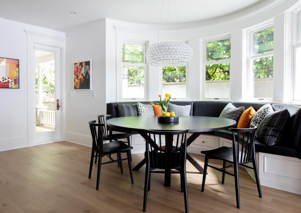 This is an example of a transitional dining room in Vancouver.