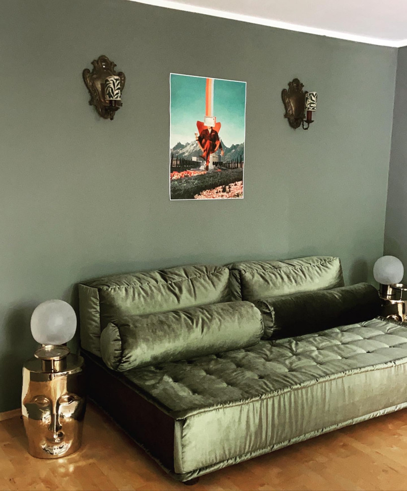 Photo of a mid-sized midcentury formal enclosed living room in Munich with green walls.