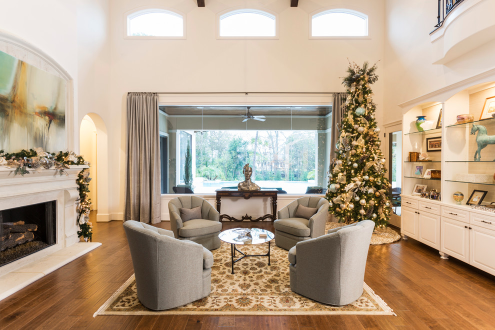 Large transitional formal open concept living room in Houston with white walls, medium hardwood floors, a standard fireplace and a stone fireplace surround.