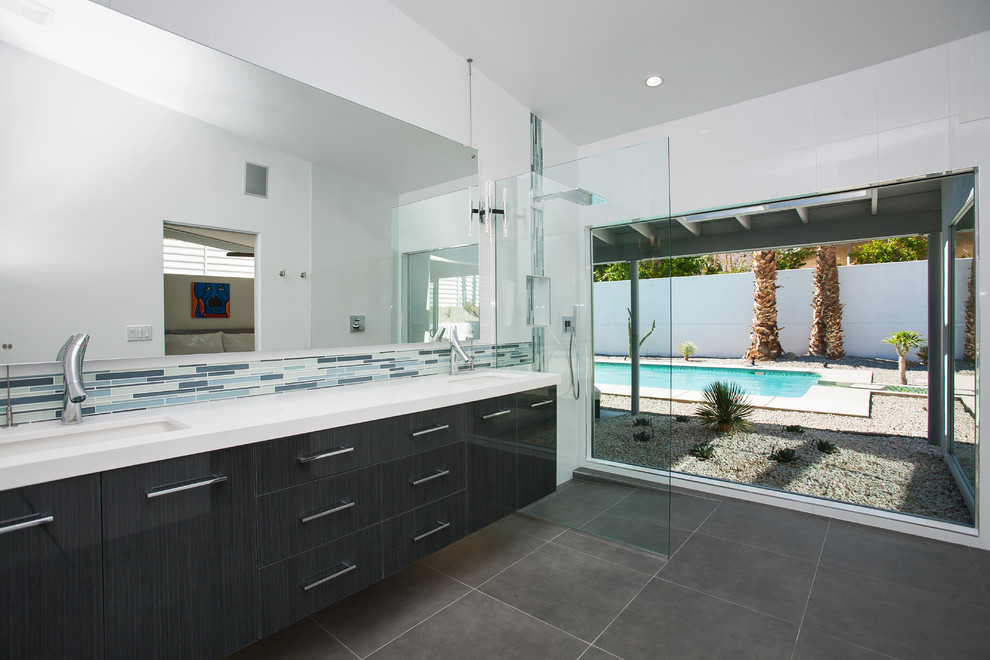 Inspiration for a large midcentury master bathroom in Other with an undermount sink, flat-panel cabinets, black cabinets, engineered quartz benchtops, a curbless shower, white walls, porcelain floors, gray tile and porcelain tile.