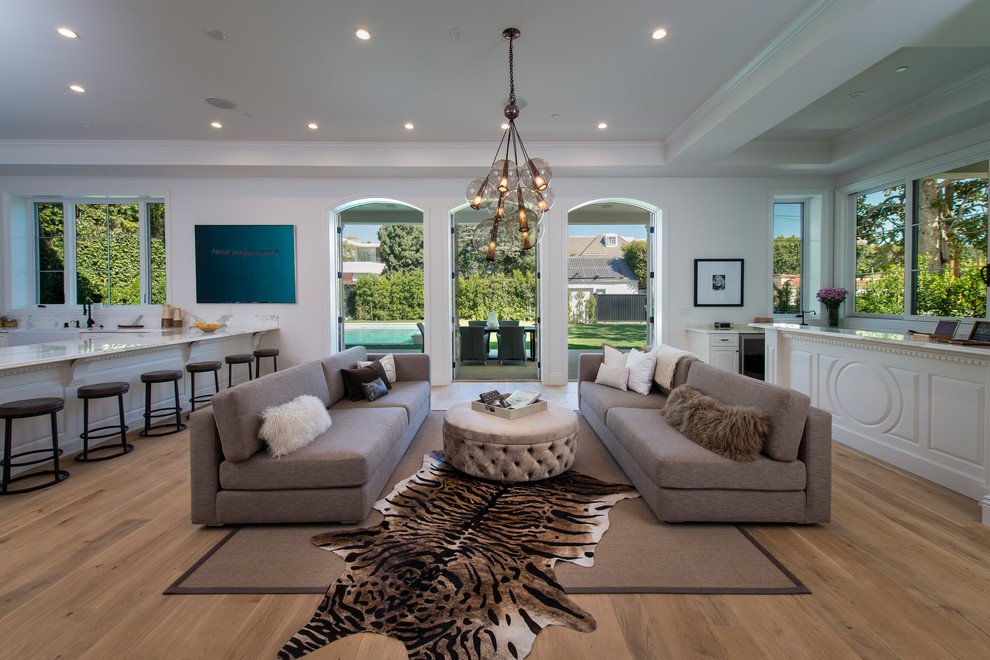 Transitional open concept living room in Other with white walls, medium hardwood floors and brown floor.