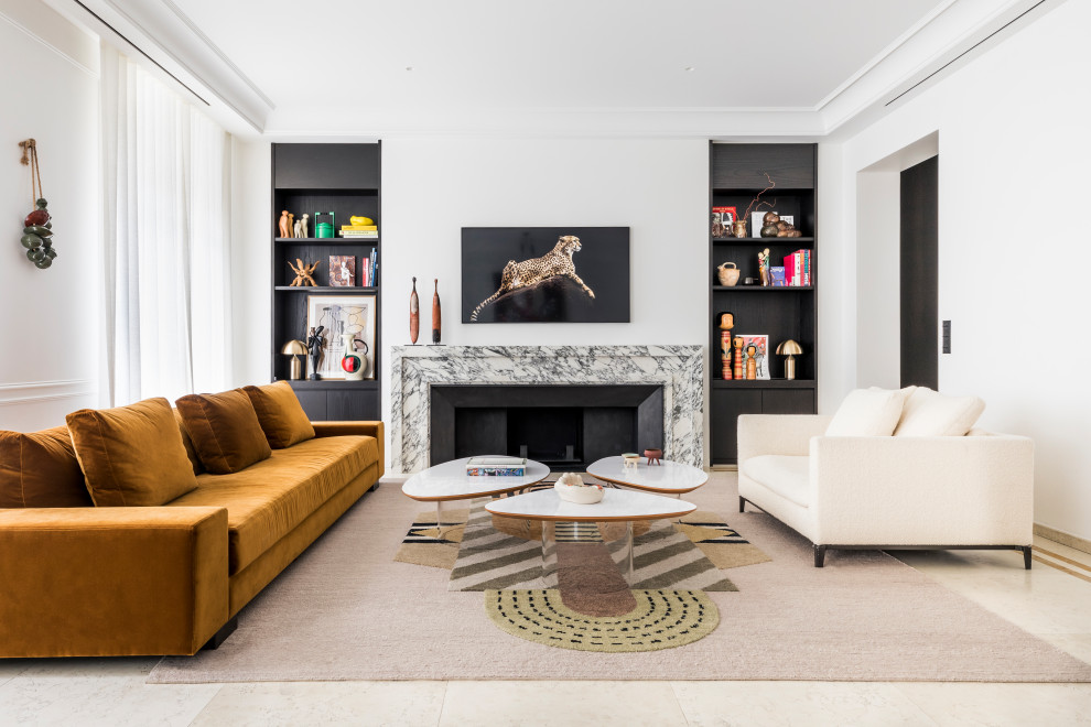 This is an example of a large contemporary open concept living room in Paris with a library, white walls, marble floors, a standard fireplace, a stone fireplace surround, a wall-mounted tv and beige floor.