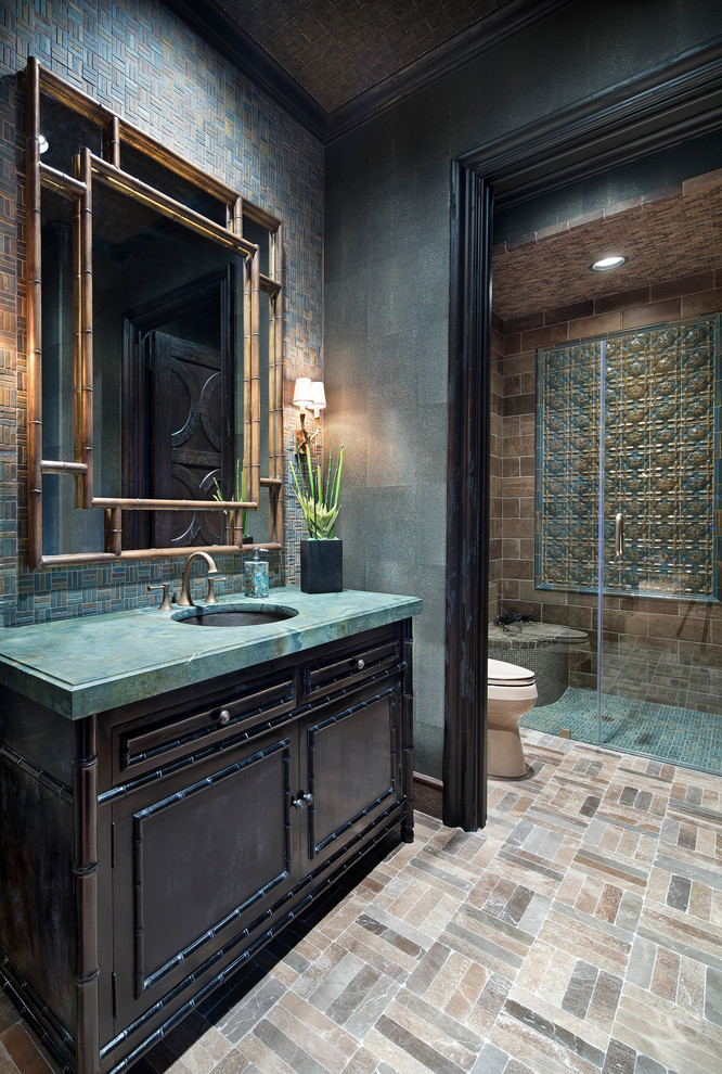 Walk-in shower - mediterranean 3/4 blue tile, brown tile, green tile and mosaic tile mosaic tile floor and beige floor walk-in shower idea in Houston with dark wood cabinets, green walls, an undermount sink, a hinged shower door and recessed-panel cabinets