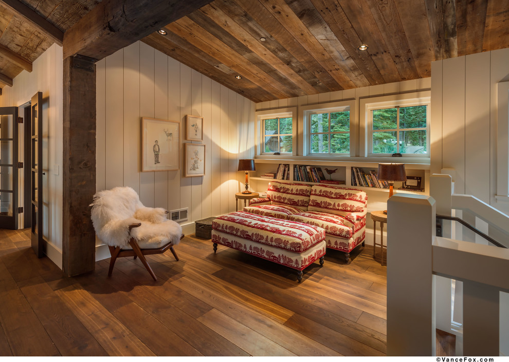 Inspiration for a mid-sized country loft-style family room in Sacramento with a library, white walls, medium hardwood floors, no fireplace and no tv.