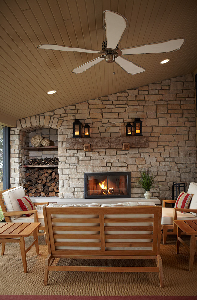 Design ideas for a country patio in Grand Rapids with a roof extension.