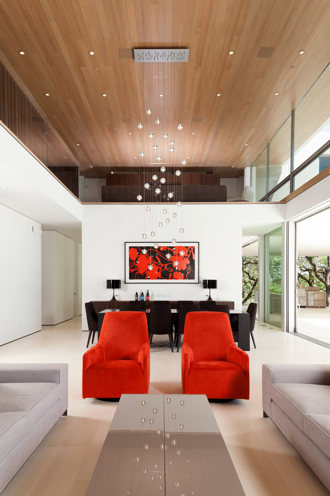 This is an example of a contemporary formal living room in San Francisco with white walls and limestone floors.