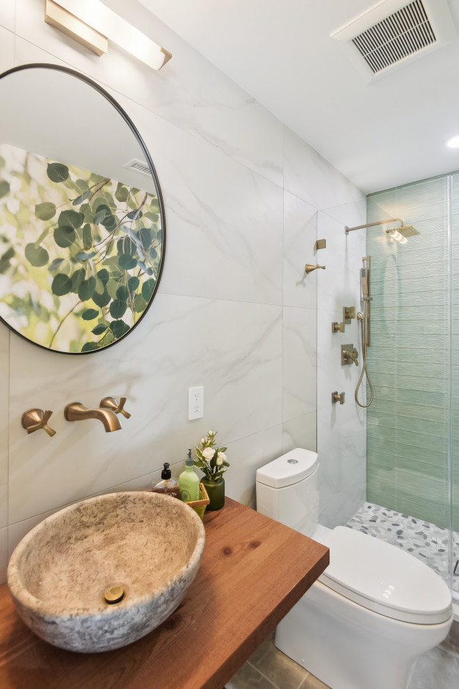 Small country shower room bathroom in DC Metro with open cabinets, brown cabinets, an alcove shower, beige tiles, ceramic tiles, cement flooring, a vessel sink, wooden worktops, a hinged door, a single sink and a floating vanity unit.