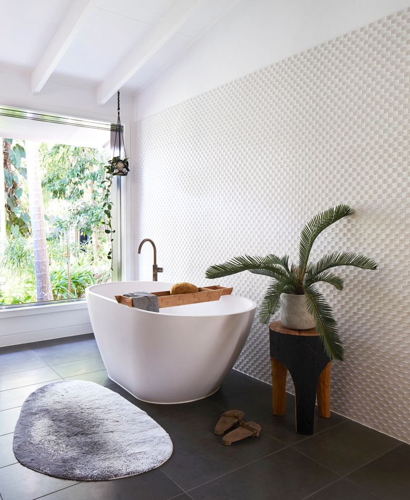 Contemporary bathroom in Brisbane with a freestanding tub and white tile.