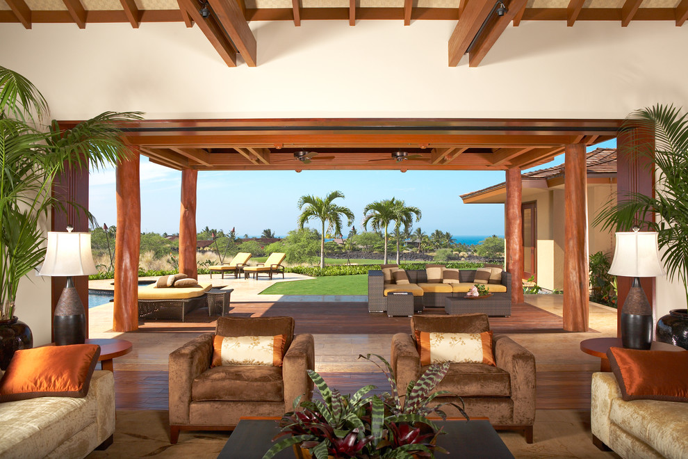 Inspiration for an expansive tropical living room in Hawaii with beige walls.