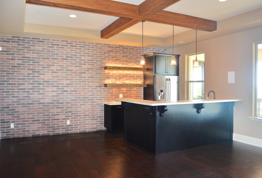 Home design - mid-sized transitional l-shaped dark wood floor home design idea with shaker cabinets, black cabinets and solid surface countertops