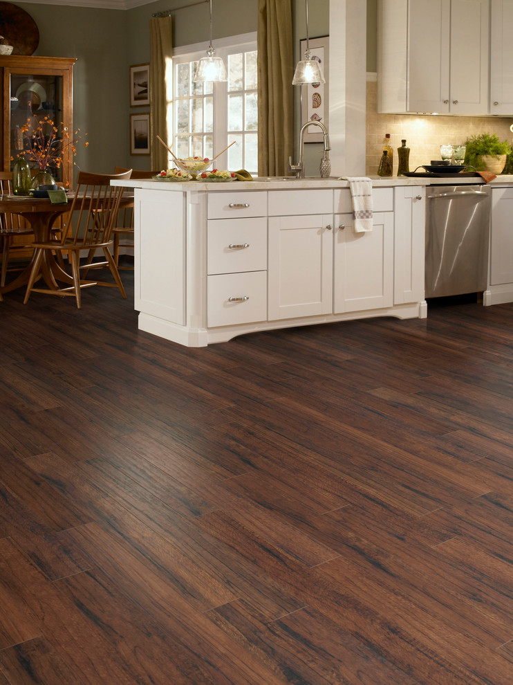 Inspiration for a mid-sized transitional single-wall dark wood floor and brown floor eat-in kitchen remodel in Orange County with an undermount sink, recessed-panel cabinets, white cabinets, marble countertops, beige backsplash, ceramic backsplash, stainless steel appliances and a peninsula