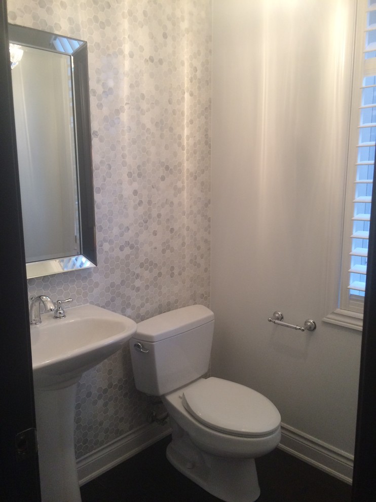 Powder room - small transitional gray tile and mosaic tile powder room idea in Toronto with a pedestal sink, a two-piece toilet and gray walls