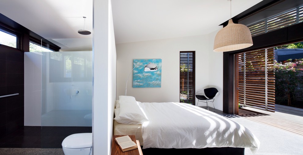 Inspiration for a modern bedroom in Melbourne with white walls.