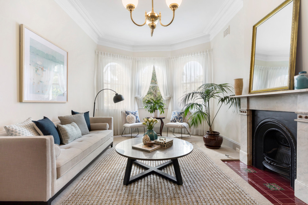 Photo of a traditional formal enclosed living room in Sydney with carpet, a standard fireplace and a stone fireplace surround.