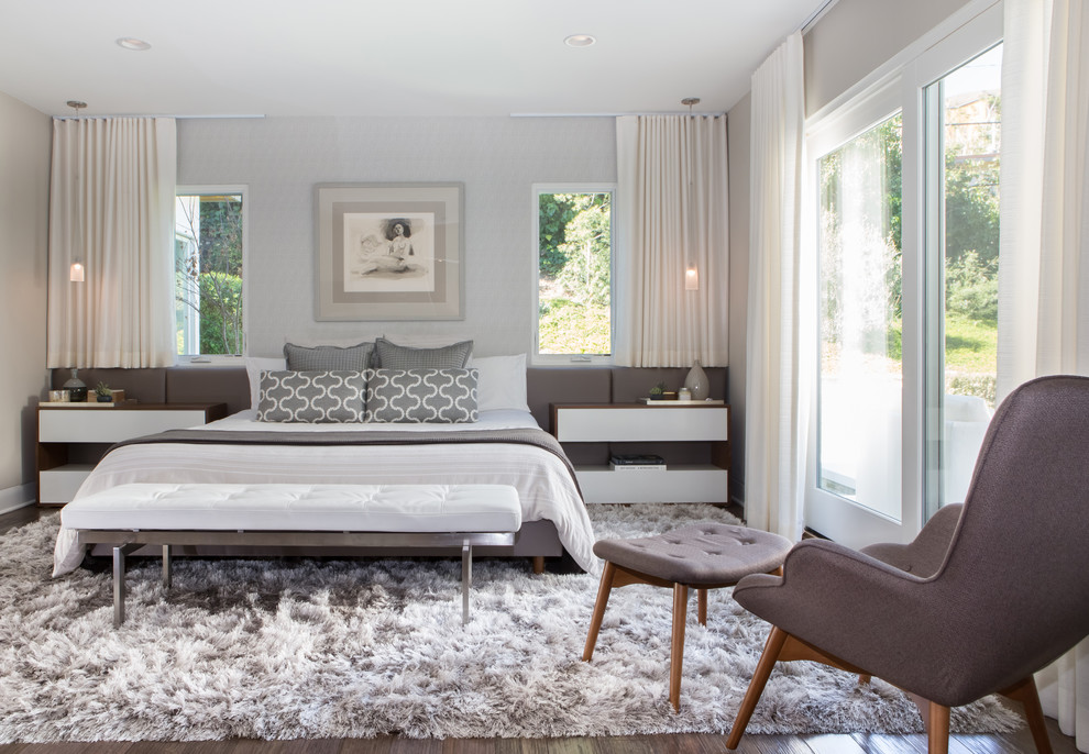 Design ideas for a contemporary bedroom in Los Angeles with grey walls, dark hardwood floors and no fireplace.