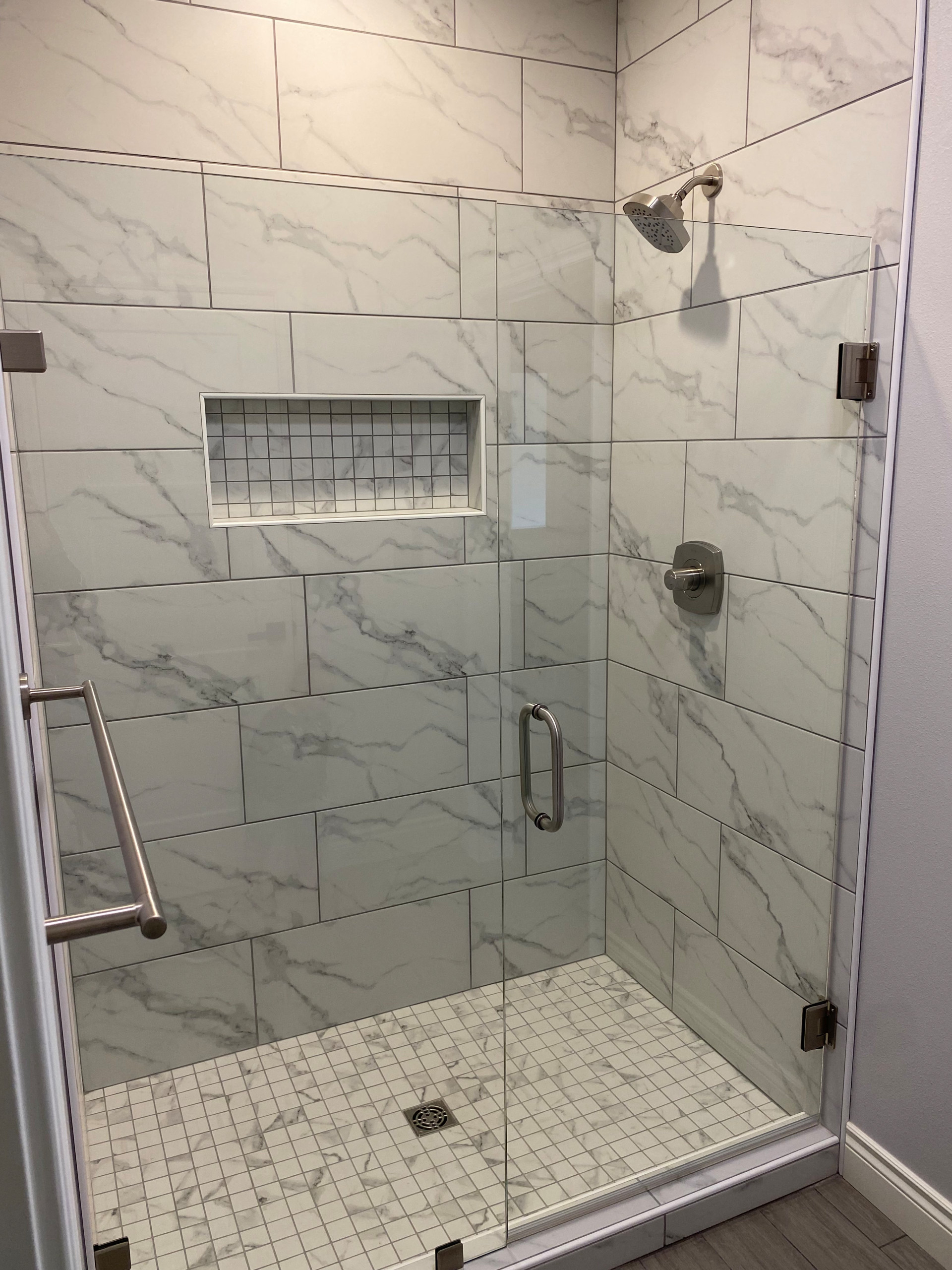 Jack and Jill custom shower with shower niche and glass door