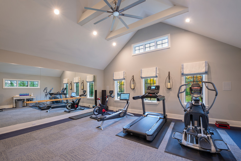 Large minimalist laminate floor, gray floor and vaulted ceiling multiuse home gym photo in New York with gray walls