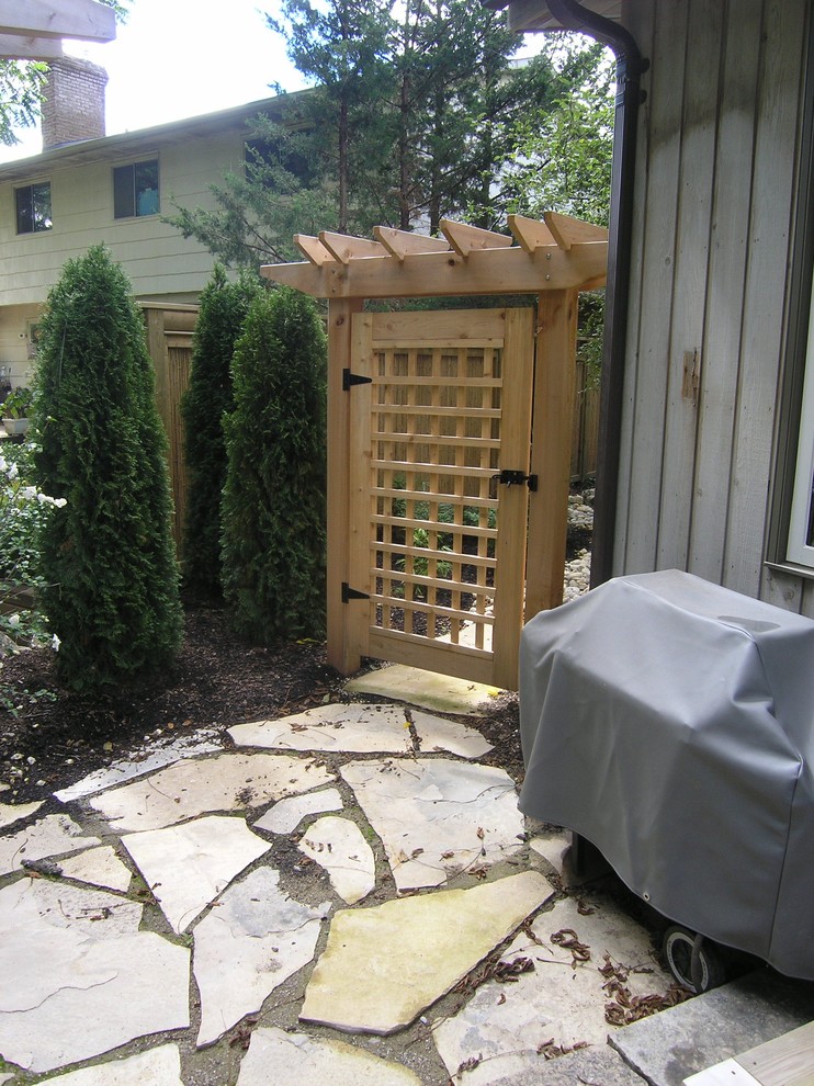Inspiration for a large contemporary backyard full sun driveway in Toronto with brick pavers.