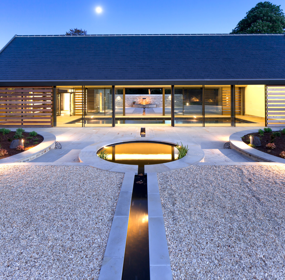 Contemporary garden in Gloucestershire with a water feature.