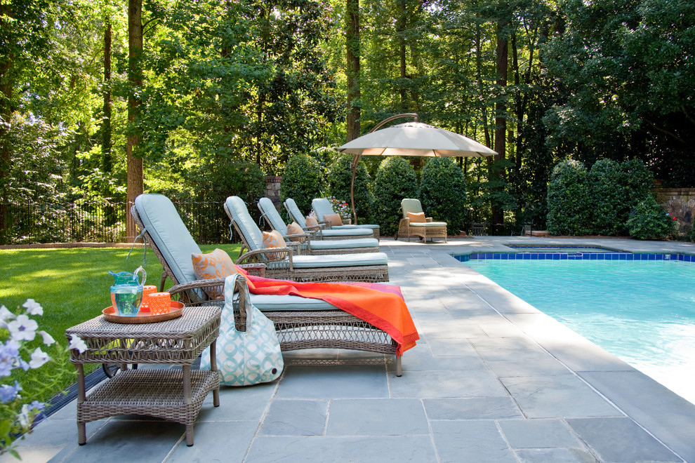 Traditional rectangular pool in Atlanta with a hot tub.