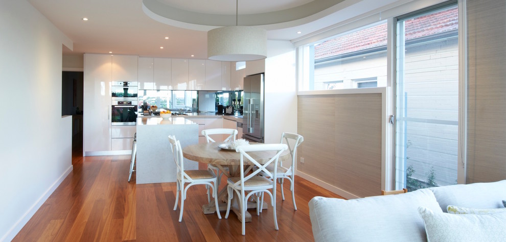 Photo of a mid-sized contemporary kitchen/dining combo in Sydney.