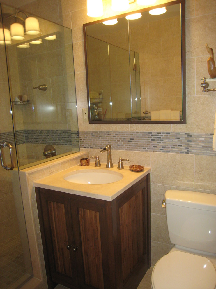 Mid-sized asian master bathroom in New York with medium wood cabinets, an alcove shower, a two-piece toilet, beige tile, matchstick tile, beige walls, marble floors, an undermount sink and marble benchtops.