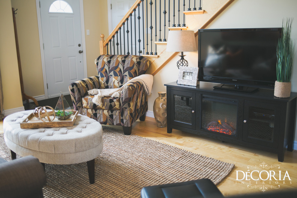 Home design - small transitional formal and open concept light wood floor and beige floor home design idea with beige walls, a standard fireplace and a tv stand