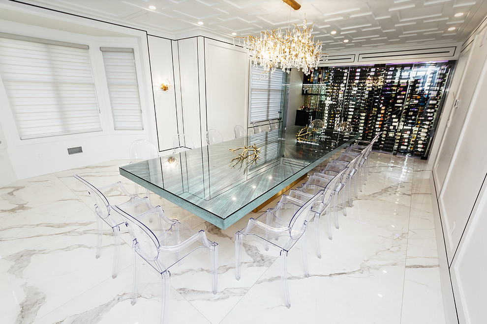 This is an example of a mid-sized modern dining room in New York with marble floors and white floor.