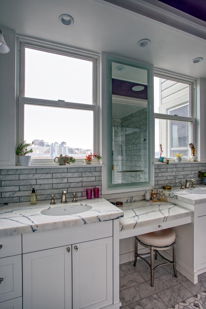 Design ideas for a medium sized classic ensuite bathroom in San Francisco with shaker cabinets, white cabinets, an alcove shower, a wall mounted toilet, white tiles, stone tiles, white walls, marble flooring, a submerged sink, marble worktops, purple floors, a hinged door, white worktops, double sinks, a built in vanity unit, a coffered ceiling and panelled walls.