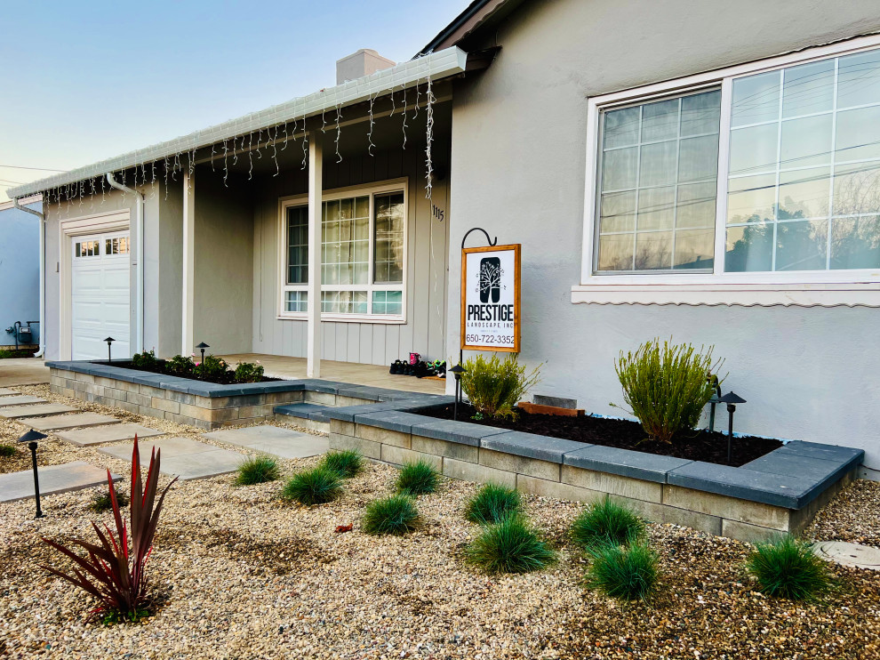 Design ideas for a desert look modern front yard full sun xeriscape in San Francisco with gravel.